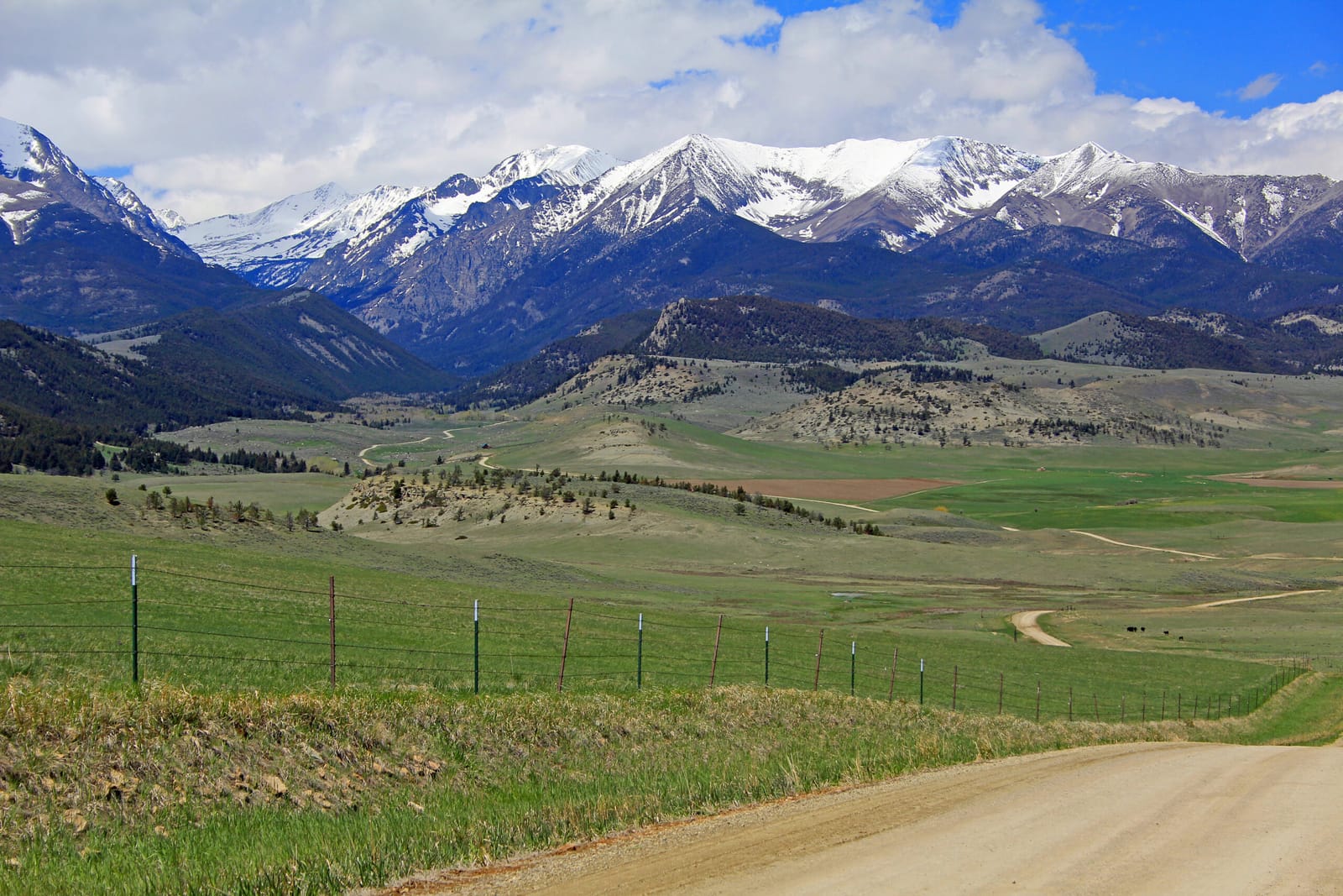 A ranch fence line below the mountains in Paradise Valley